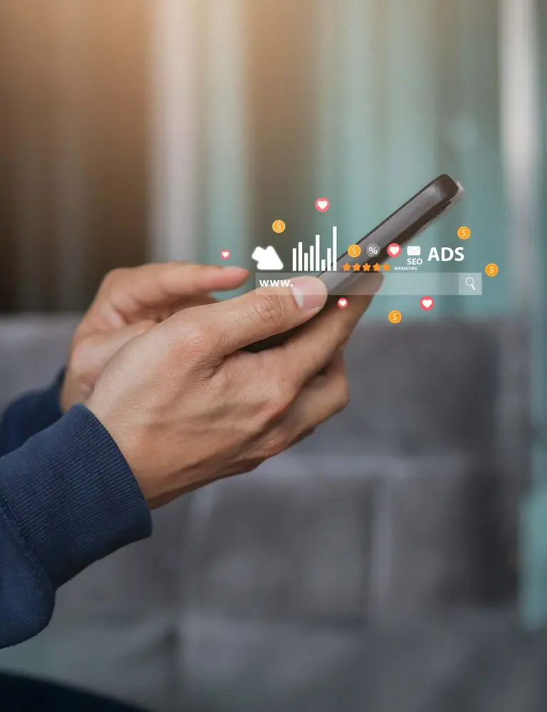 Hands holding a phone with data flowing out to represent Amazon sellers managing PPC