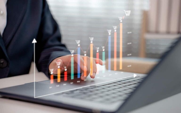Amazon seller at computer reviewing sales data in prep for Amazon Prime Big Deal Days